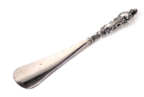 A silver handled shoe horn.