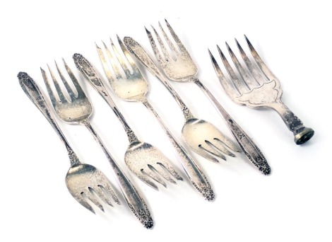 A set of six Prelude serving forks, each stamped International Sterling, with floral topped end, bearing the initial D, and a silver plated A1 fish server lacking handle. (7)