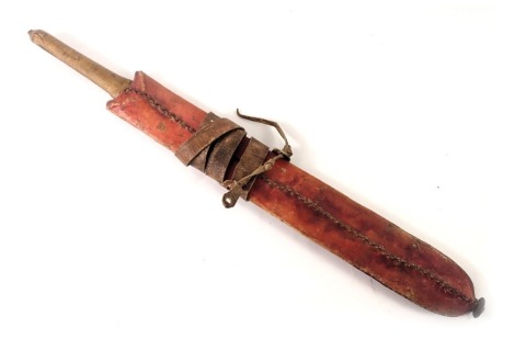 An African short sword or cleaver, the blade stamped Diamond BF 18", with leather handle and stained red leather scabbard, 54cm long overall.