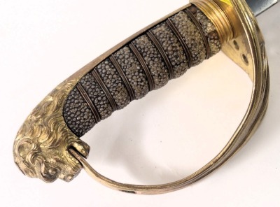 A late 19th/early 20thC naval dress sword, with plain un-engraved blade, the brass guard cast with anchor and a crown, and with shagreen and copper bound handle, lacking scabbard, 71cm long overall. - 3