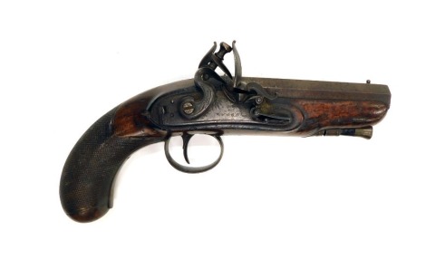 An early 18thC flintlock pistol by Wood, with octagonal barrel, with fore-sight, with ram rod, chequered grip and signed lock plate.