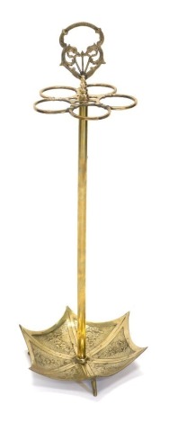 A brass five division umbrella stand, modelled in the form of an umbrella, cast with flowers, etc., 81cm high.