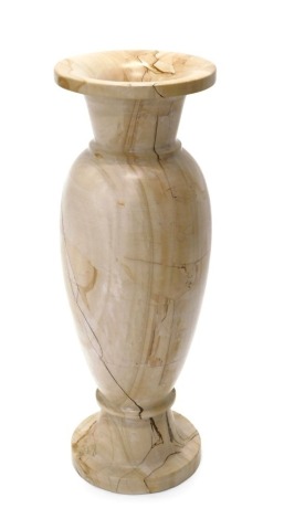 A large turned stone vase, with brown marble type configuration, 74cm high.