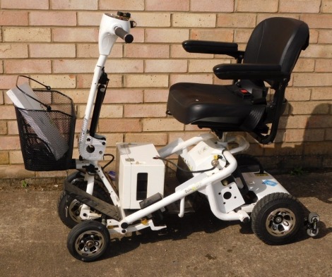 A Quingo Air 2 mobility scooter, with charger, welcome pack, etc.