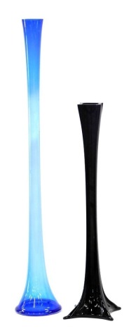 A large blue Art Glass trumpet shaped vase, 106cm high, and a black example, 76cm high.