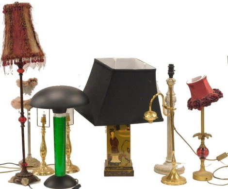 An Oriental lacquer style table lamp, decorated with figures and flowers on a black ground, and various other decorative table lamps. (AF)