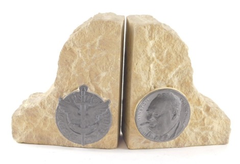 A pair of carved stone book ends, each applied with plaque for Freedom Justice and Peace, another Winston Churchill 1941, in base metal or lead.