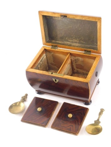 A Victorian rosewood and boxwood strung sarcophagus shaped tea caddy, the hinged lid enclosing two lidded compartments, on bun feet, 20cm wide.