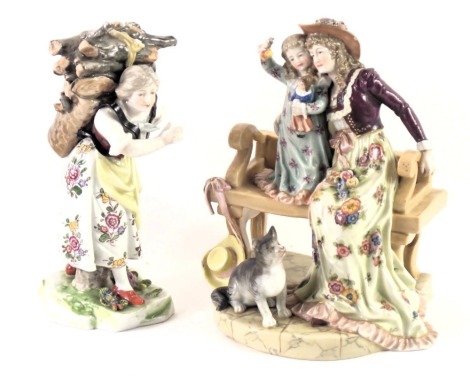 Two German continental porcelain figures, comprising lady with wicker basket of logs, with blue cross loop stamp to underside, 16cm high, and a figure group of mother and child with brown M&N and crown stamped to underside, 17cm high. (2)