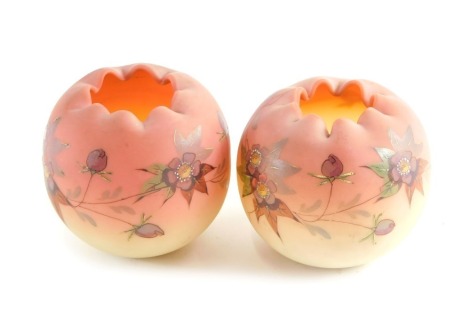 A pair of Victorian pink and cream opaque globular glass vases, each decorated with flowers in raised enamels, 7cm high.