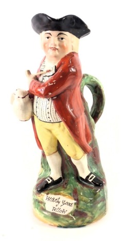 A 19thC Hearty Good Fellow Toby jug, with painted decoration in red overcoat and titled, 27cm high. (AF)