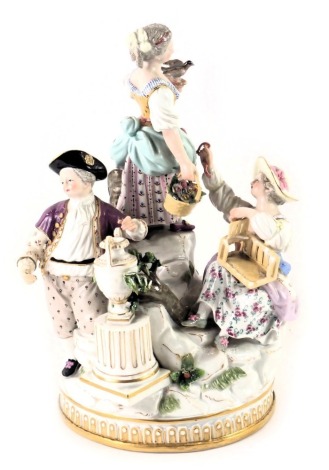 A Dresden porcelain figure group, of three figures on stepped stage base, with blue cross sword type mark to underside, 21cm high. (AF)