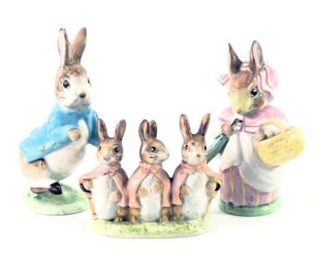 Three Beswick Beatrix potter figures, comprising Peter Rabbit, Flopsy, Mopsy, and Cotton Tail and Mrs Rabbit, 11cm high. (3)