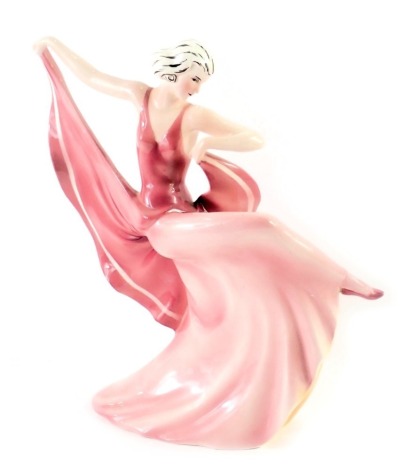 A Katzhutte German Art Deco figure of a lady, in pink flowing dress, with green stamp to underside, 25cm high. (AF)