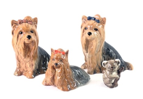 Four animal ornaments, comprising two Sylvac Yorkshire terriers, a Beswick Yorkshire terrier numbered 1944, and a Beswick Koala, the largest 14cm high. (4)