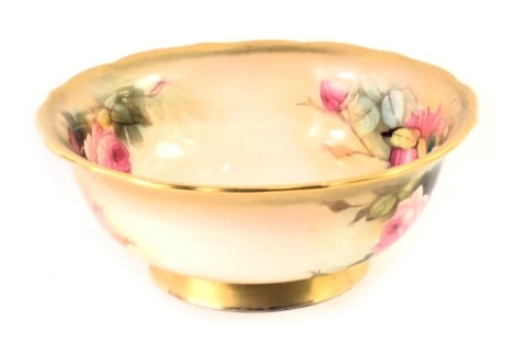 A Royal Worcester bowl, with gilt fluted border, painted rose decoration bearing signature Sedgley, with purple stamp to underside, 20cm diameter.