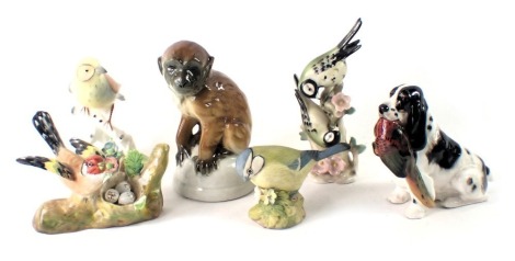 Various bird and animal ornaments, comprising a seated orangutan, Goebel and Beswick birds, Adderley bird group, and a Royal Doulton dog carrying pheasant. (6)