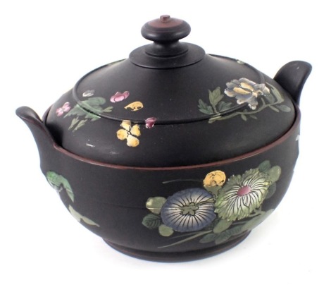 A Wedgwood black basalt and enamelled covered sugar bowl, two lip handles and gilt decoration of flowers, in pink, blue and yellow, 11cm high.