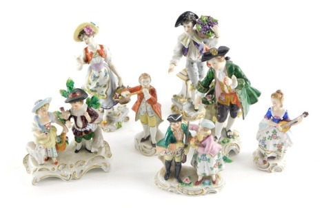 Seven continental porcelain figure groups, comprising various Sitzendorf and others, the largest 15cm high.