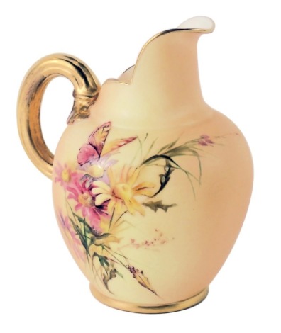 A Royal Worcester blush ivory jug, with gilded handle, painted with butterflies and flowers, with puce Worcester stamp to underside, numbered 1094, 14cm high.