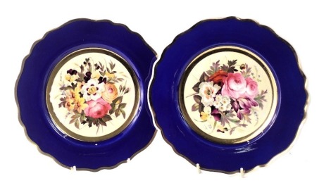 A pair of 19thC Chamberlain Worcester plates, each with a blue border and central bouquet of flowers, on a yellow ground, with Chamberlain Worcester stamp to underside, 22cm diameter.