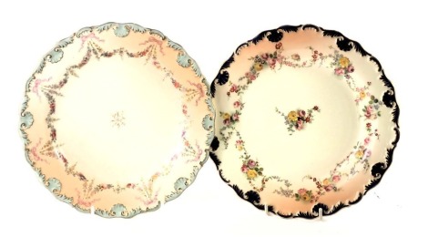 Two Royal Worcester blush ivory cabinet plates, one with a royal blue shell border and painted floral swag detail, with puce Worcester stamp to reverse, the other with turquoise border, and green Worcester stamp, 22cm diameter.