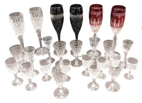 A quantity of cut glass, to include Waterford ruby flash and black flash champagne flutes, a pair of clear champagne flutes, etc.