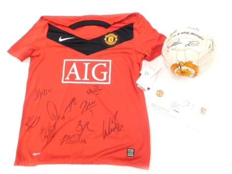 A signed Manchester United 1999 treble winners football and a Manchester United shirt. (2)