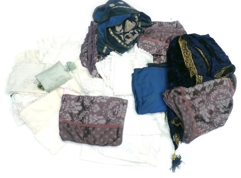 A quantity of textiles, to include a blue gold embroidered velvet bed cover, a velvet valence, possibly for a bed, etc.