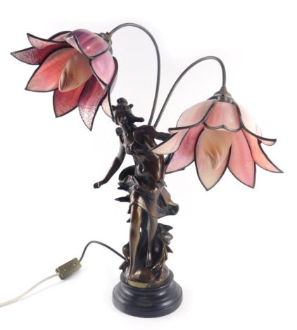 A bronzed resin Art Nouveau style table lamp, with two branches, each with coloured stain glass petals, 48cm wide. WARNING! This lot contains untested or unsafe electrical items. It is supplied for scrap or re-conditioning only. TRADE ONLY