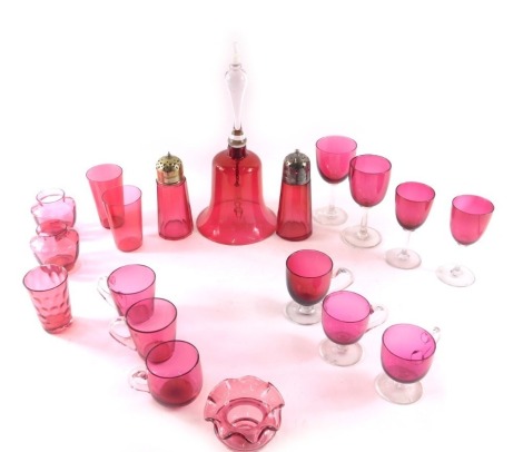 A cranberry tinted glass bell, with clear handle, various cranberry tinted custard cups, wine glasses, etc.