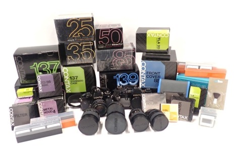 A quantity of Contax camera accessories, a Contax 137MD quartz body, a Contax 138 quartz camera and lens, etc.