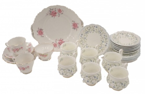 A Royal Albert Caroline pattern part tea service, for six, and a Royal Albert part service, decorated with flowers, etc. (2 trays)