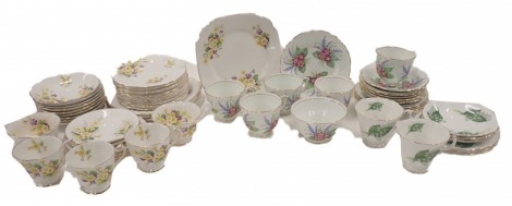 A Royal Stuart part service, a Richmond porcelain part service, and a Royal Albert service decorated with yellow and purple flowers. (2 trays)