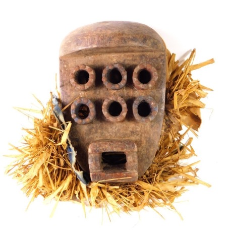 An African tribal Grebo six eyed soul mask, Liberia circa 1950, 30cm high.