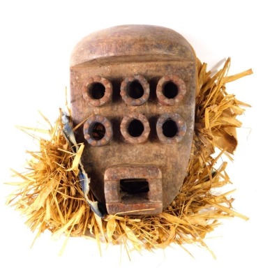 An African tribal Grebo six eyed soul mask, Liberia circa 1950, 30cm high.