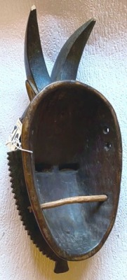 An African tribal Baule Divination mask, with two horns, Cote D'Ivoire circa 1930, 33cm high. - 2