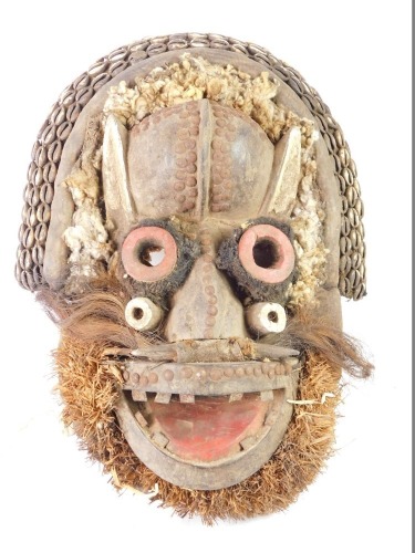 An African tribal Guere Chief's mask, embellished with horns, hare, Cote D'Ivoire circa 1950, 48cm high.