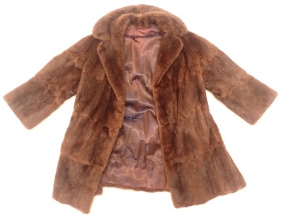 A ladies fur jacket, possibly Mink.