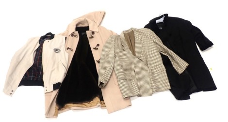 A collection of Burberry clothing, to include a beige gilet with checked lining, a fawn duffel type coat with hood, checked jacket, and a black jacket. (4)