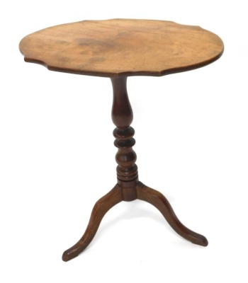 A Victorian mahogany occasional table, the shaped oval top on a turned column, tripod base, 60cm wide.