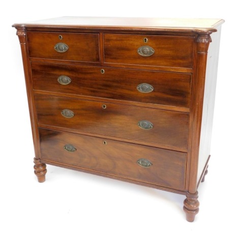 A Victorian mahogany chest of drawers, the top with a moulded edge and rounded front corners, above two short and three long drawers, with oval brass handles, flanked by pilasters on bun feet, 115cm high, 124cm wide.