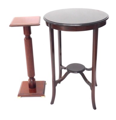 An Edwardian mahogany two tier table, on splayed legs, and a stained beech plant stand on brass feet. (2)