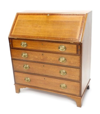 An early 19thC oak and mahogany cross banded bureau, the fall enclosing a fitted interior above four graduated drawers, each with oval brass drop handles, on bracket feet, 106cm high, 93cm wide.