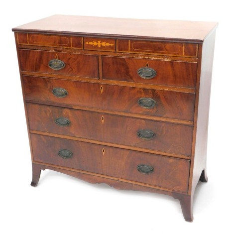 A 19thC mahogany and inlaid chest of drawers, with a plain top above two concealed frieze drawers, and a further two short and three long drawers with oval brass drop handles, on splayed feet, 108.5cm high, 111cm wide.