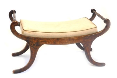 A stained beech window seat, the shaped arms with rope twist supports on sabre legs, 99cm wide.