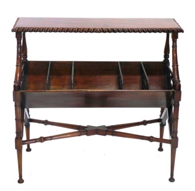 A mahogany book table, the rectangular top with a gadrooned edge above five divisions, each with a pierced divider, on shaped and turned end supports with X stretcher, 86cm high, 92cm wide