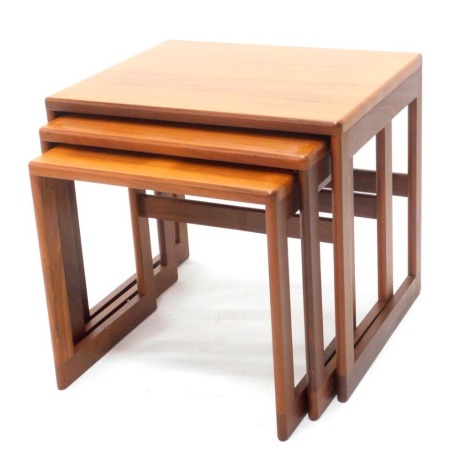 A nest of three G Plan teak tables, each on plain end supports, the largest 53cm wide.