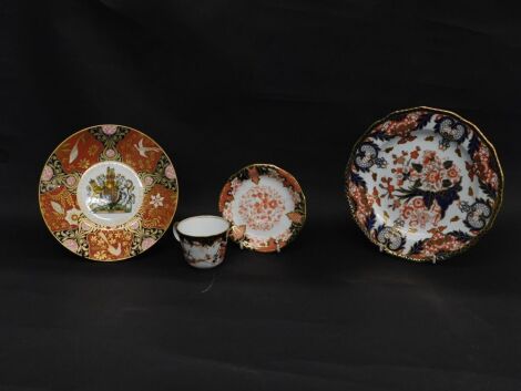 A group of Royal Crown Derby etc, comprising Imari pattern cup and saucer, Royal Worcester Queen Elizabeth II Golden Jubilee cabinet plate, and a Royal Crown Derby Imari pattern cabinet plate. (4)