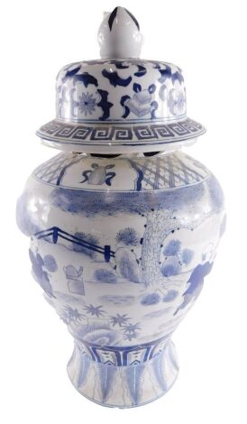 A modern Chinese blue and white vase and cover, decorated with children, leaves, scrolls, etc., 49cm high.